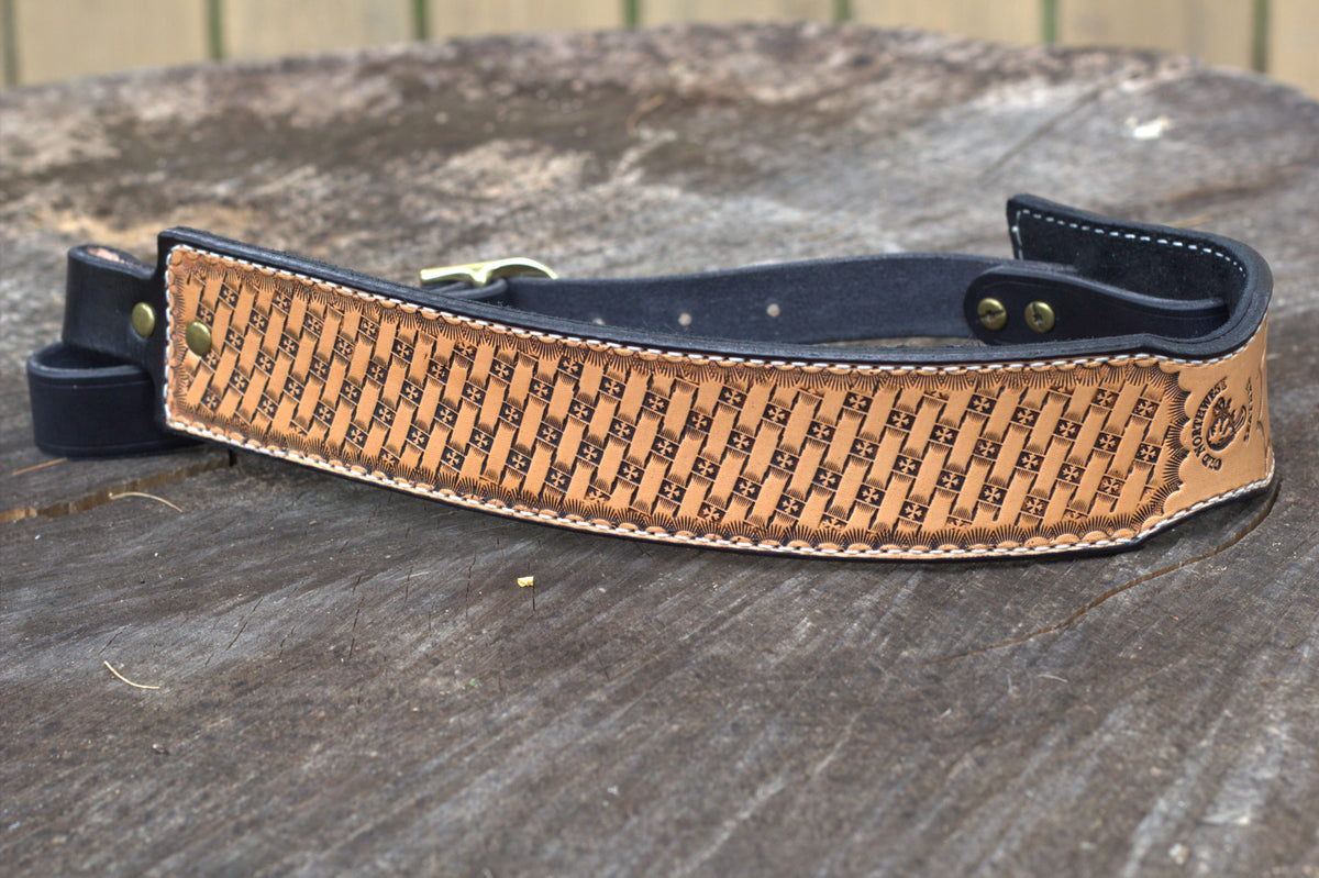 A full-grain leather rifle sling hand tooled with a basket weave design. 