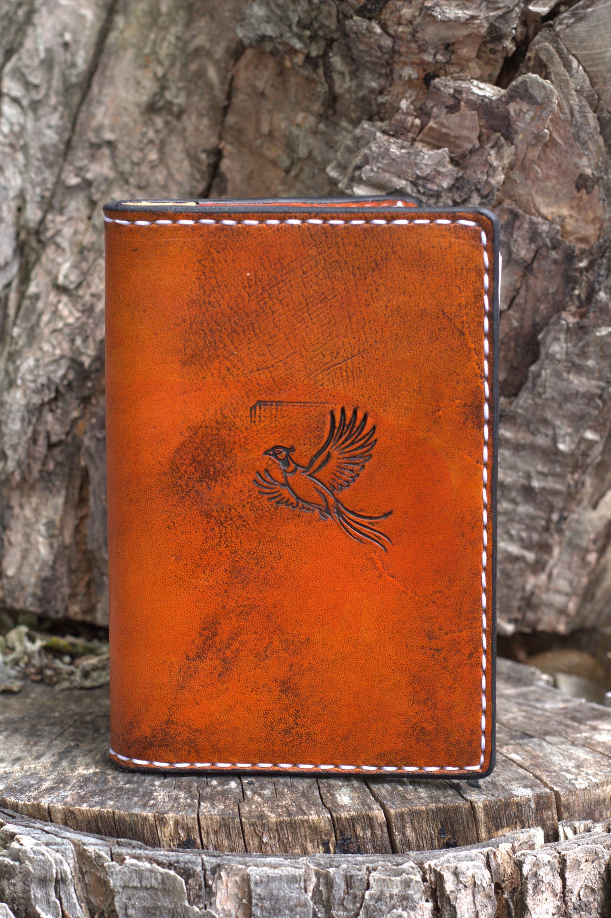 A saddle tan leather journal cover for hunters. This journal is made by hand using American leather in central Wisconsin. 