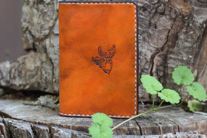 A saddle tan passport wallet handmade by Old Northwest Leather and designed to fit hunting journals.