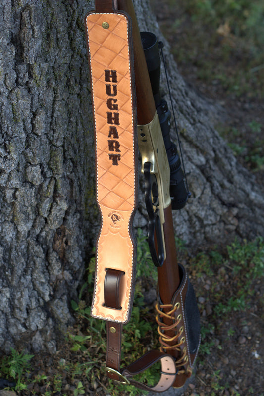 A naturally colored full-grain rifle sling that is personalized and made by hand in central Wisconsin.